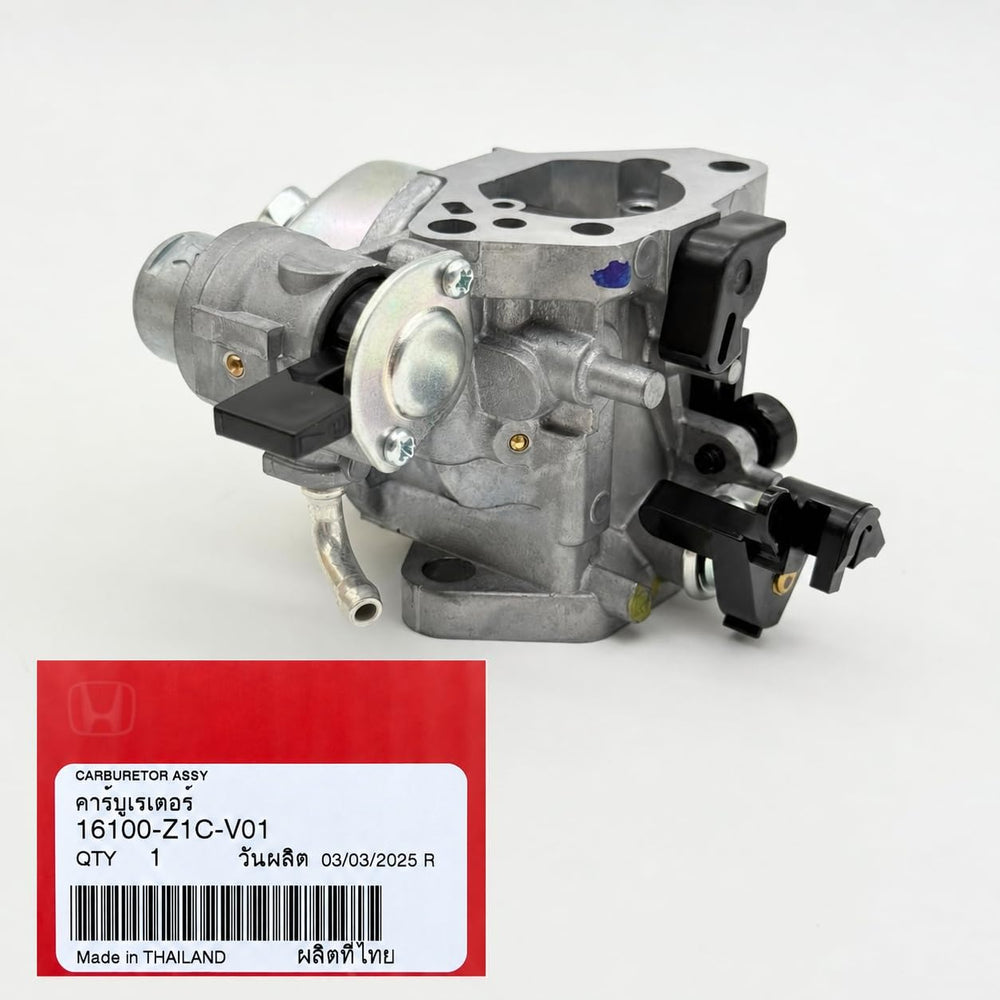KINDZA gaskets and spark plug laid out to show complete OEM replacement kit