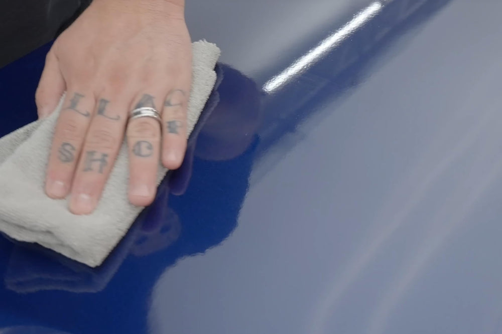 Paint panel after KOCHCHEMIE polish showing restored gloss and clarity