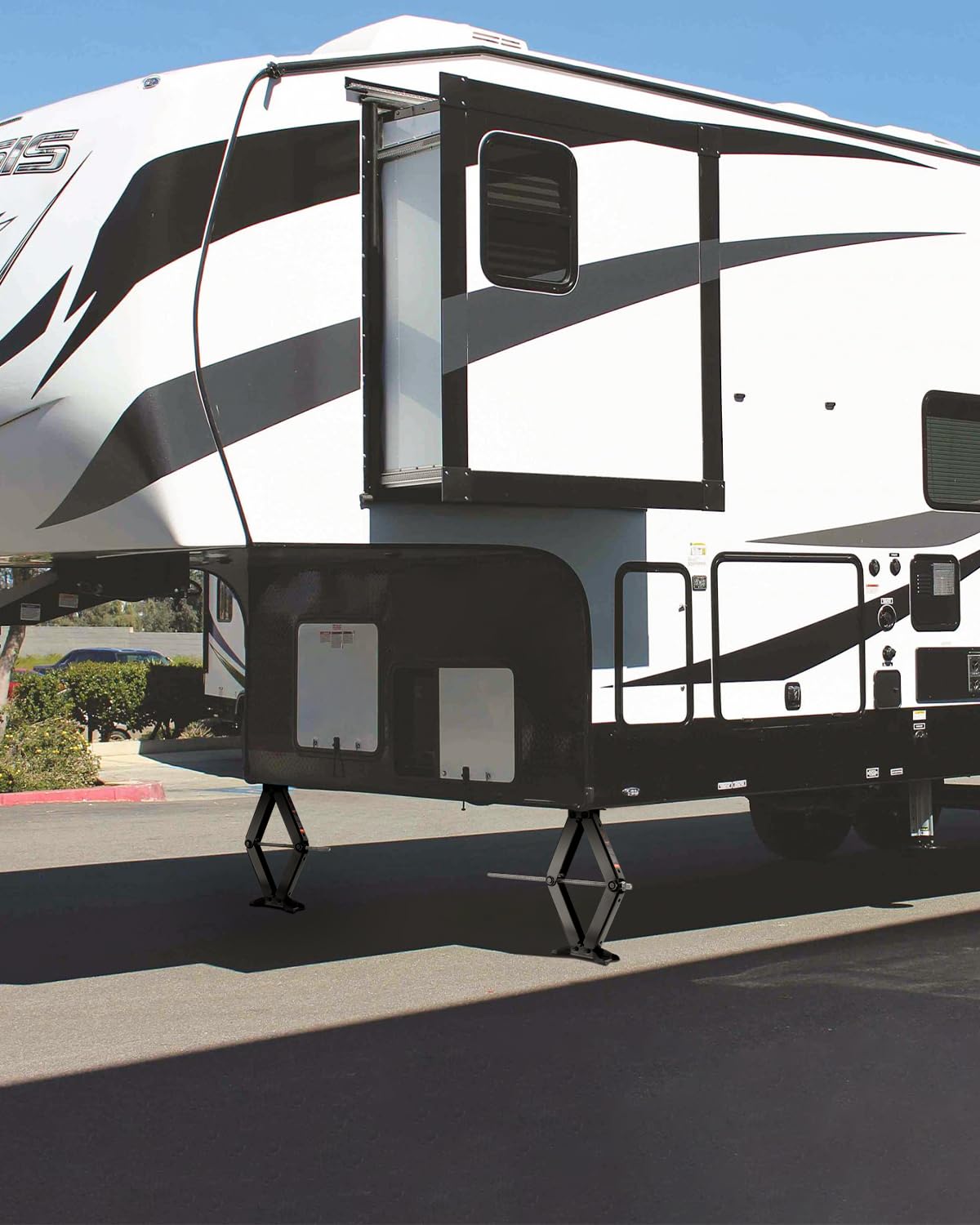 Kohree in lifestyle camping scene stabilizing a parked RV for comfortable, wobble-free living