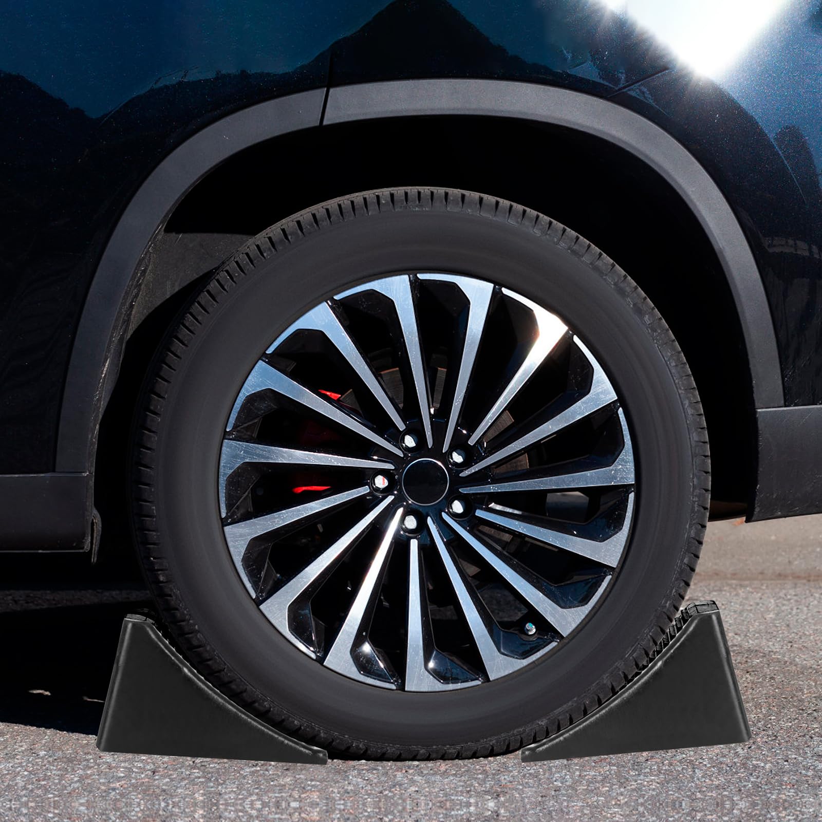 Komokeru chock placed against an RV tire demonstrating secure immobilization benefit