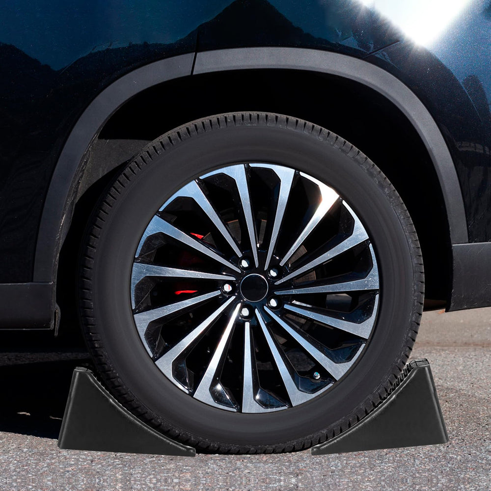 Komokeru chock placed against an RV tire demonstrating secure immobilization benefit