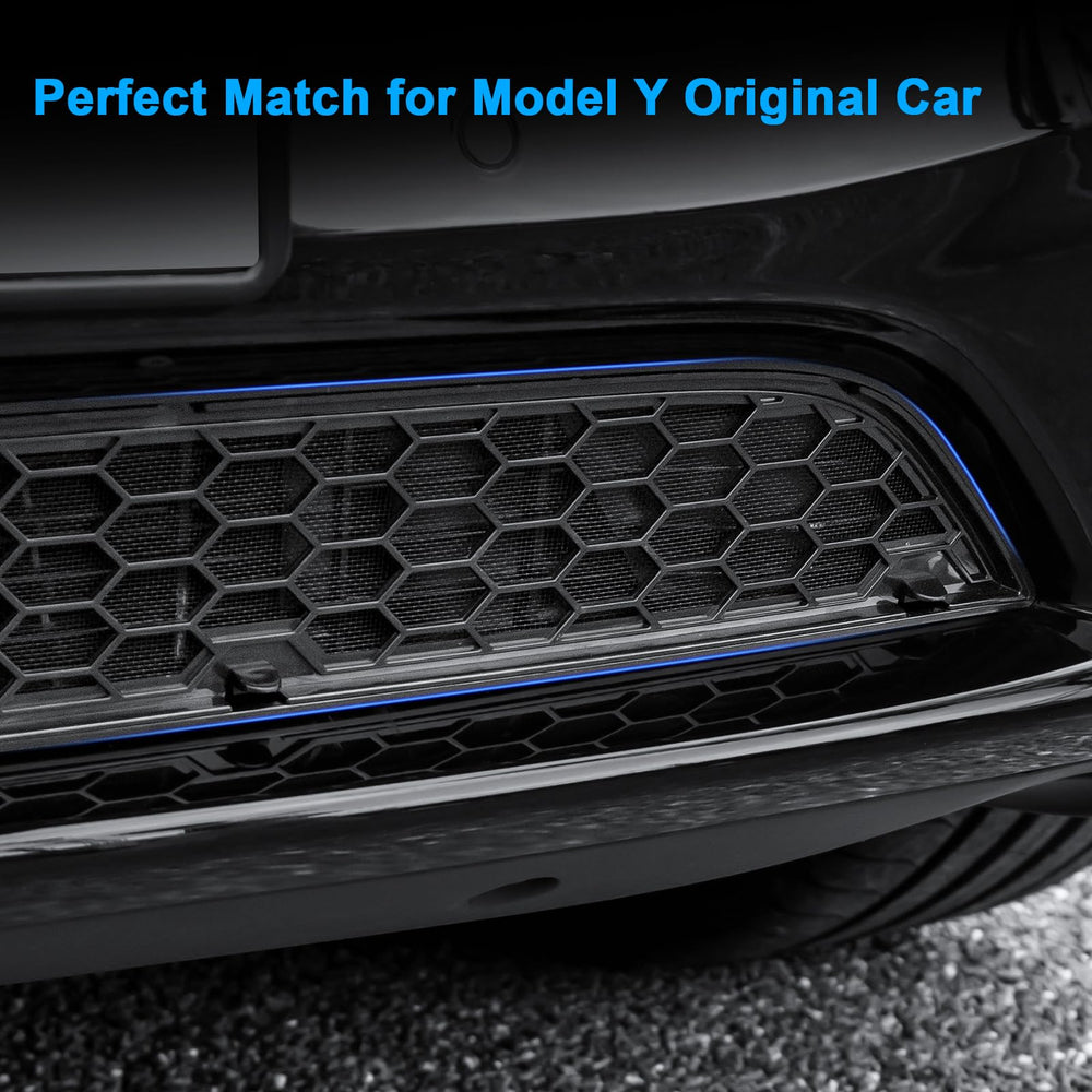 KUNIST grille on parked Model Y in roadside scene showing debris protection benefit