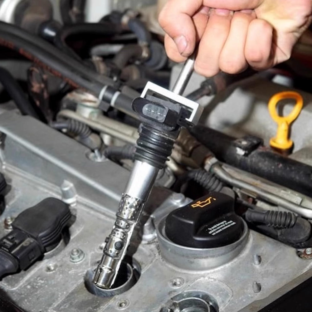 Kuntech puller in use on a VW engine demonstrating safe coil extraction