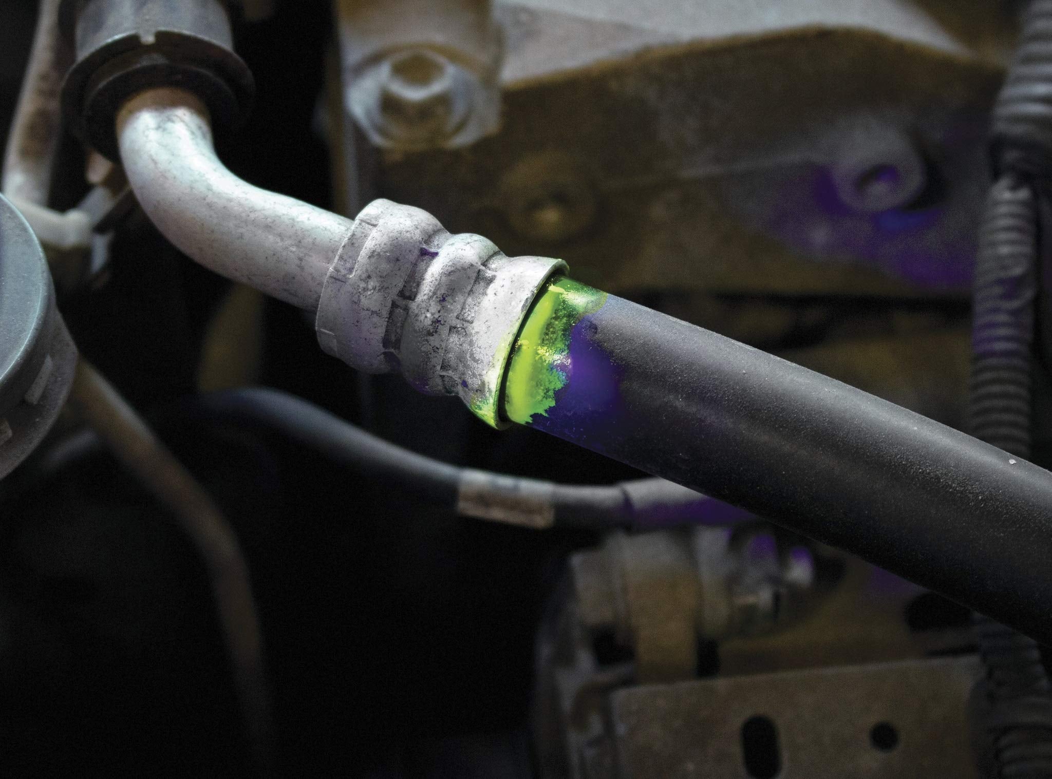 LEAKFINDER being used to inspect a vehicle evaporator core for leaks