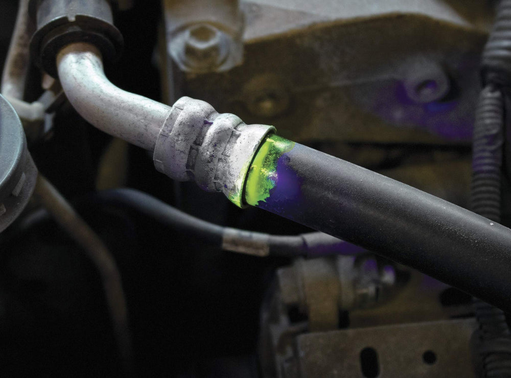 LEAKFINDER being used to inspect a vehicle evaporator core for leaks