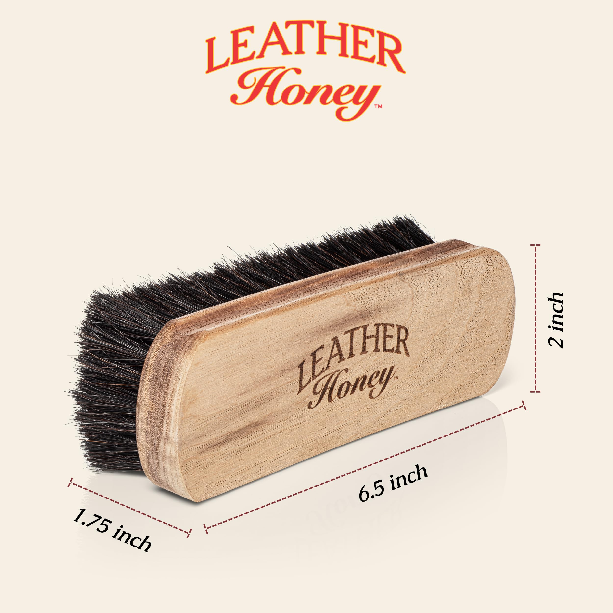 Leather Honey brush on sofa surface lifting dust for cleaner furniture maintenance
