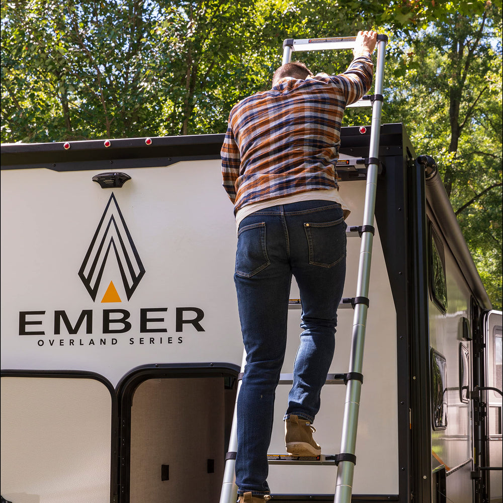 Lippert ladder being climbed to access RV roof safely and comfortably