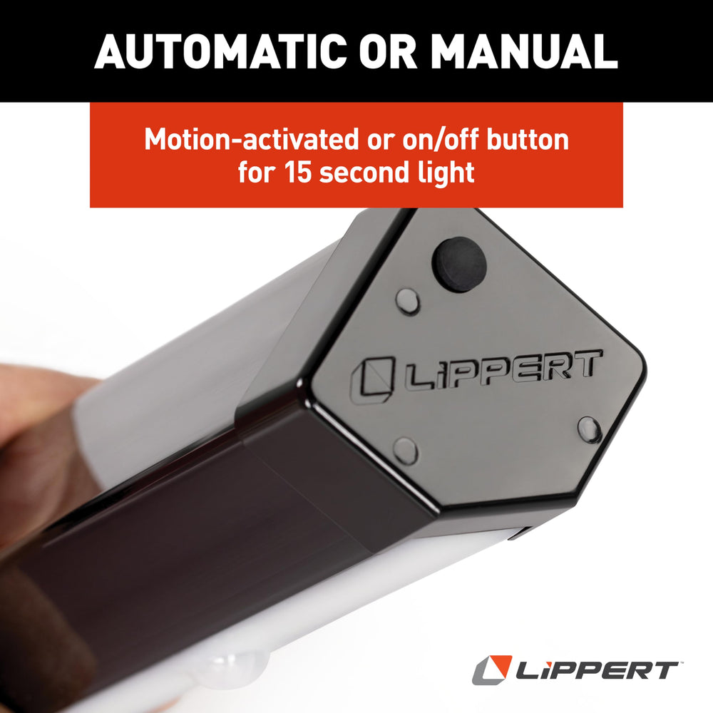 Lippert step light illuminating RV patio at night for safer walkways