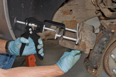 Lisle 25750 in use on caliper showing even piston compression benefit