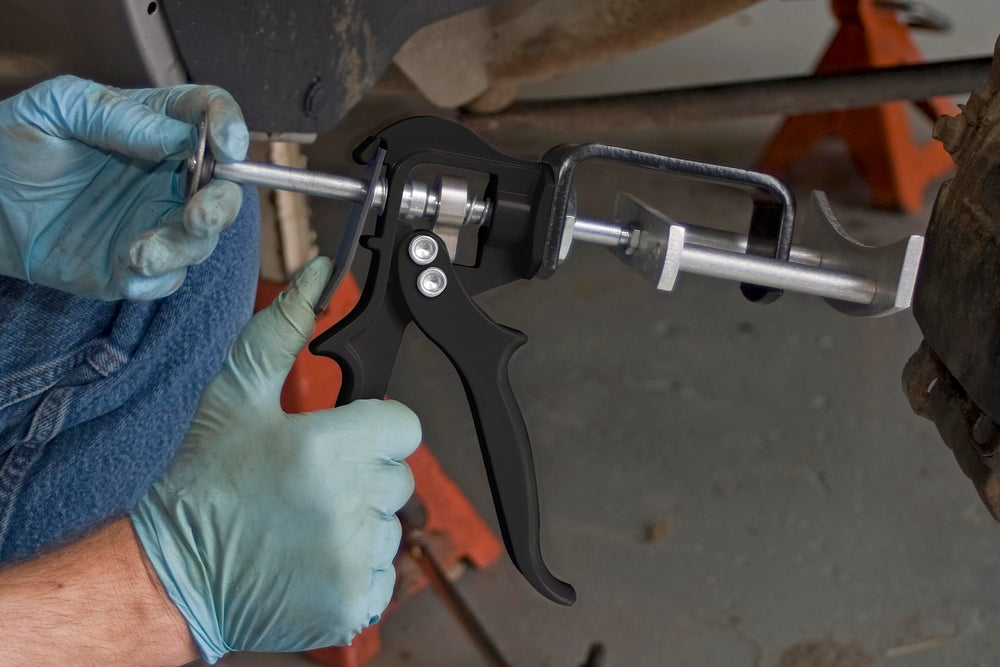 Lisle 25750 size comparison with wrench showing portable tool convenience