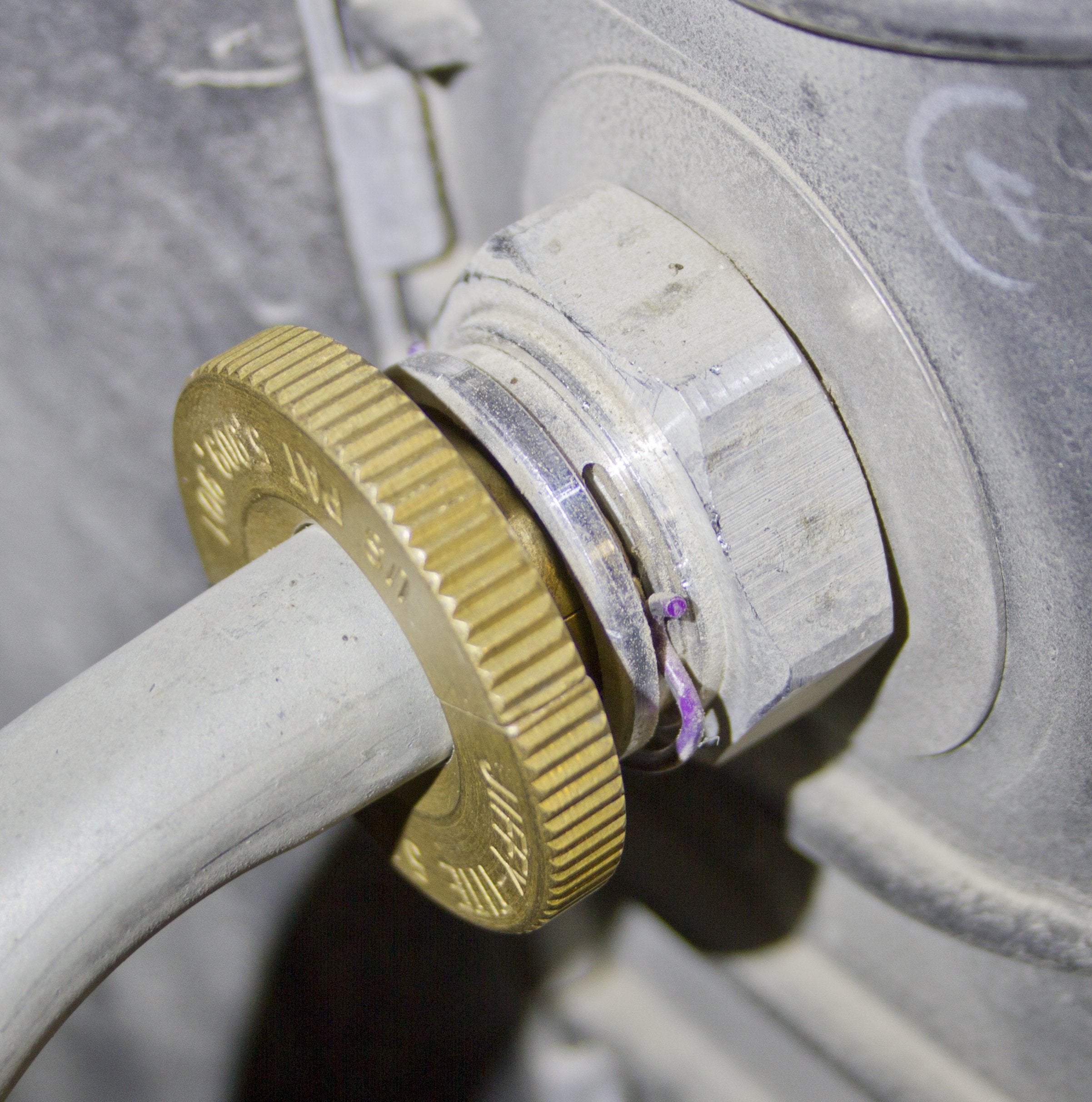 Lisle disconnect in use inside engine bay demonstrating safe removal of a Jiffy-tite line