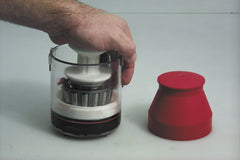 Lisle Handy Packer in use packing a bearing, demonstrating cleaner, even grease distribution