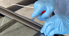 Lisle tool in use seating rope into windshield gasket, speeds installation and control