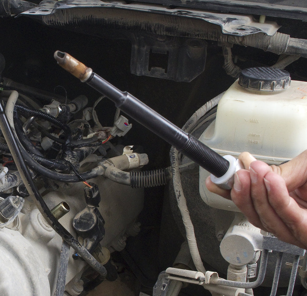 Lisle 65700 kit in use on Ford 3V engine showing safe extraction workflow