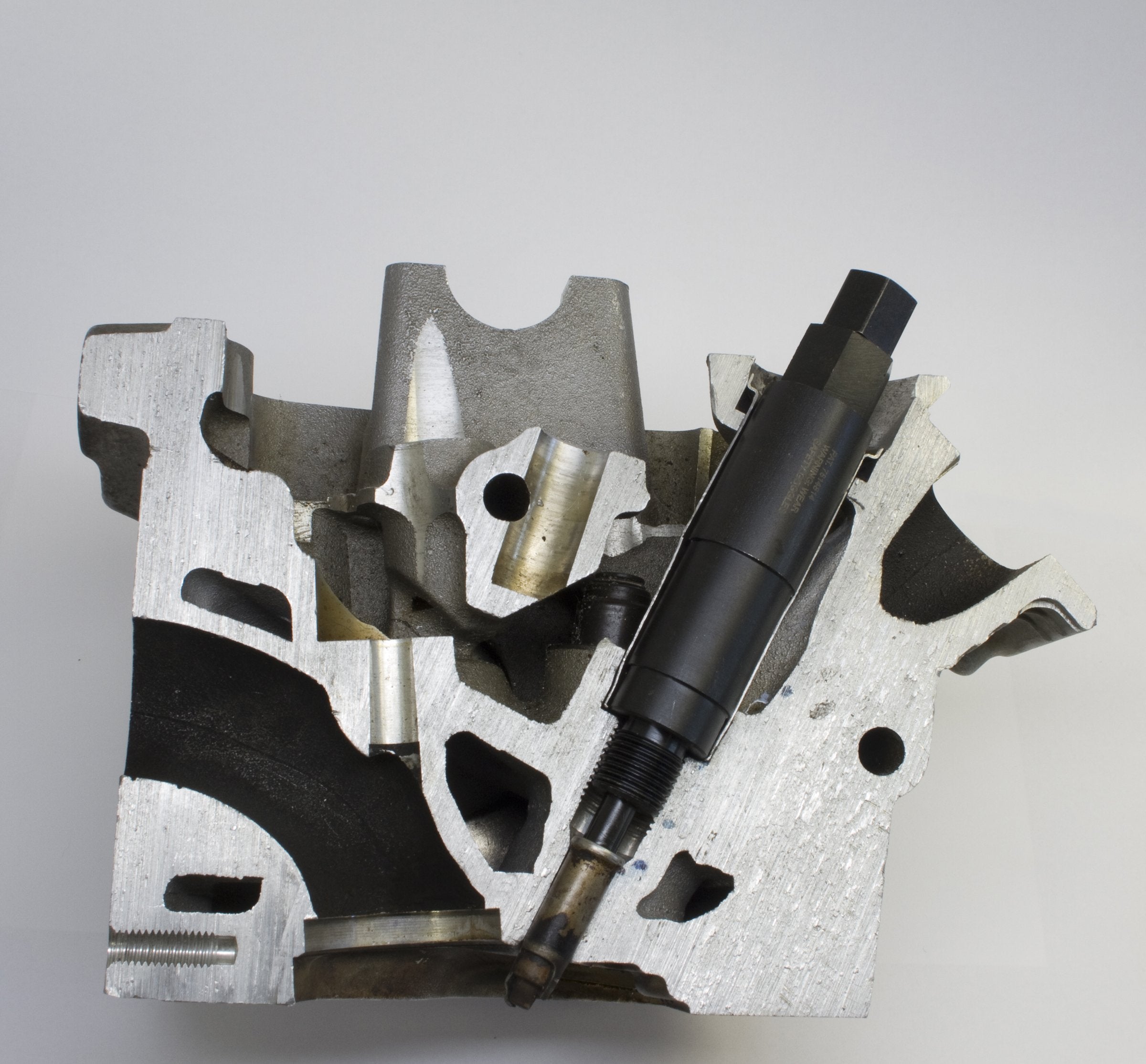Lisle self-tapping puller cutting into seized spark plug tip for removal