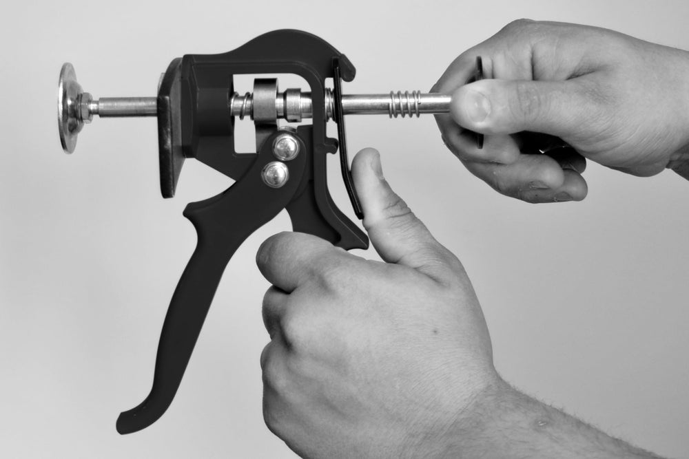 Lisle Speedy Brake Pad Spreader in use on caliper demonstrating fast piston compression