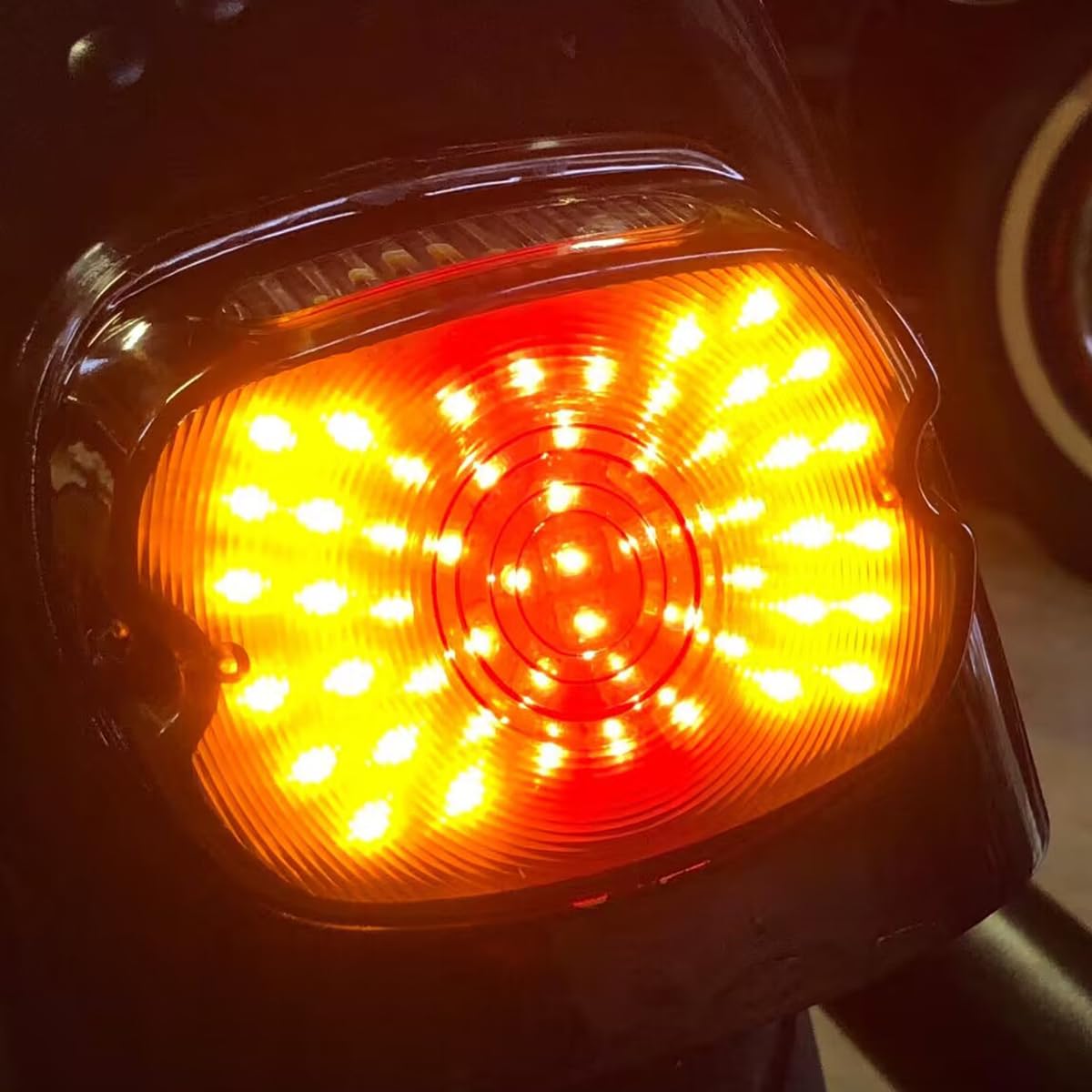 LIUJJYH tail light next to a ruler showing compact size and low-profile fit