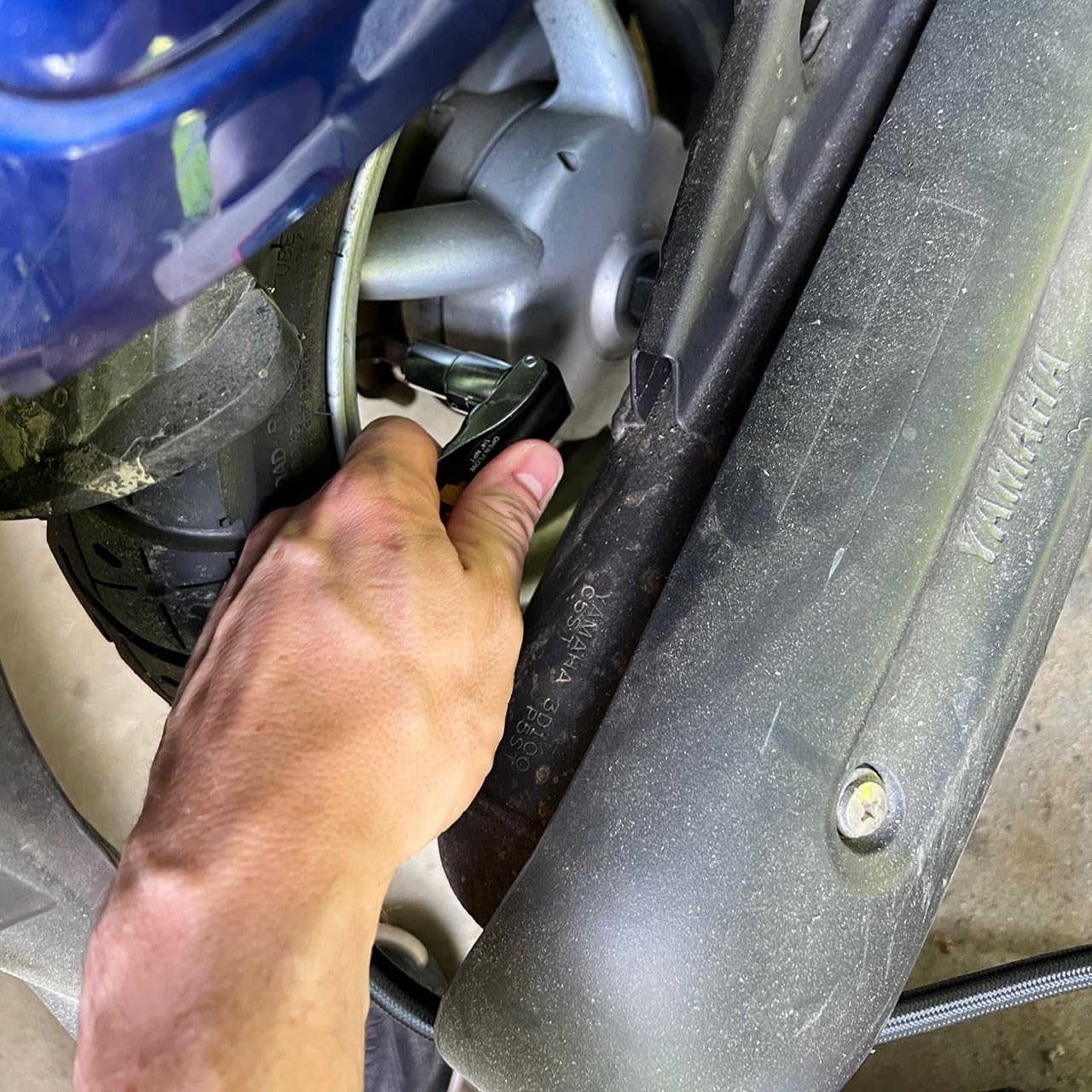 LockNFlate attached to motorcycle Schrader valve showing easy access benefit
