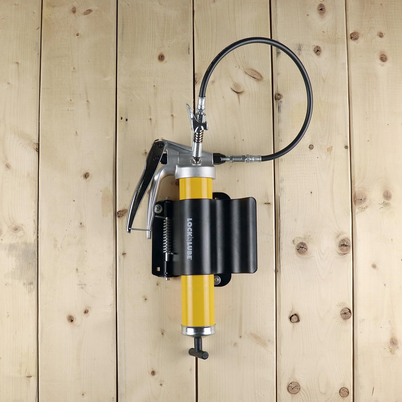 LockNLube holder shown with bolts for scale and easy-installation clarity