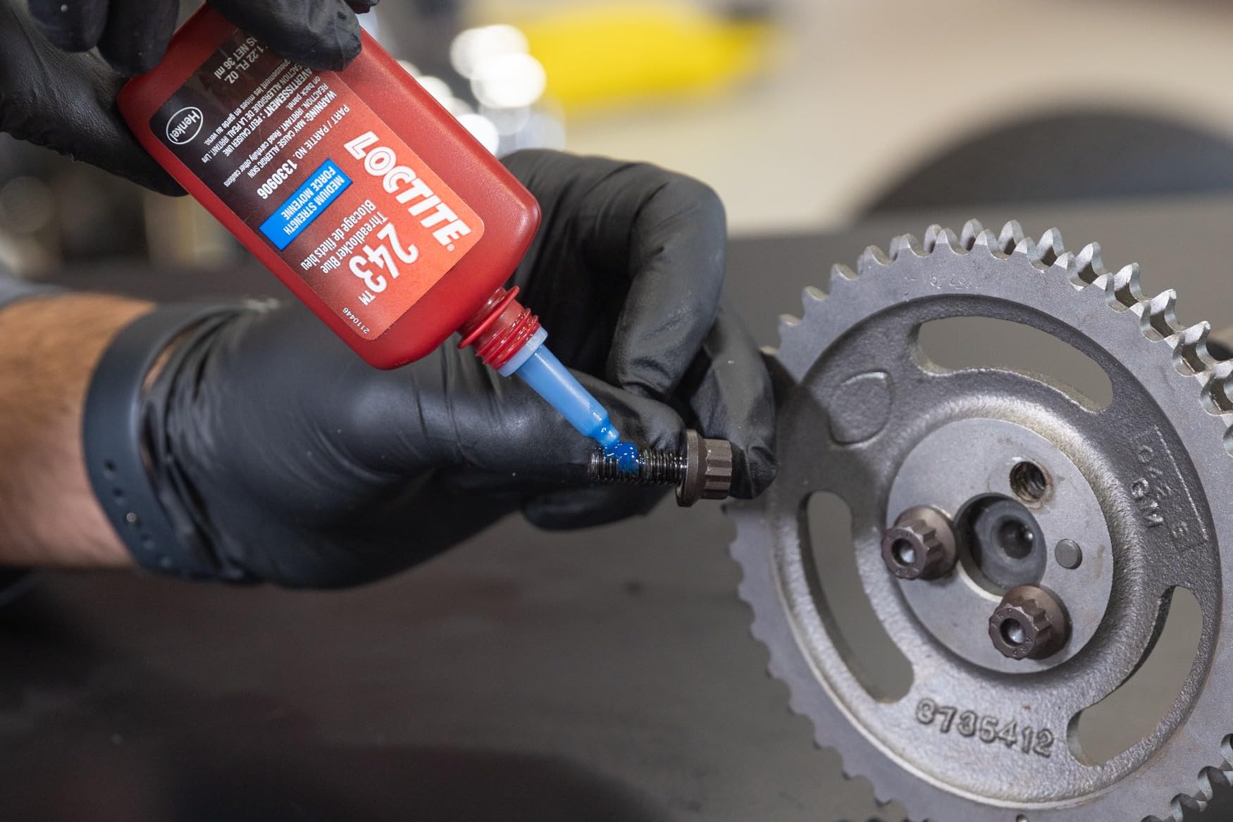 Loctite 243 beside a ruler showing bottle size for scale