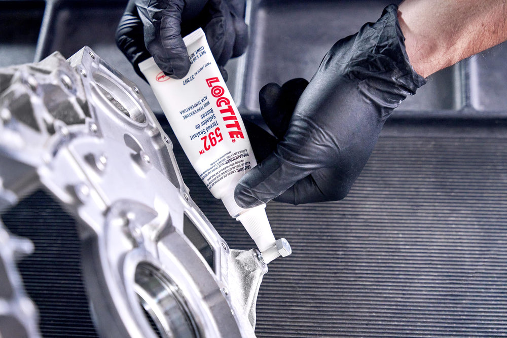 Loctite 592 on a mechanic workbench demonstrating professional use and reliable sealing