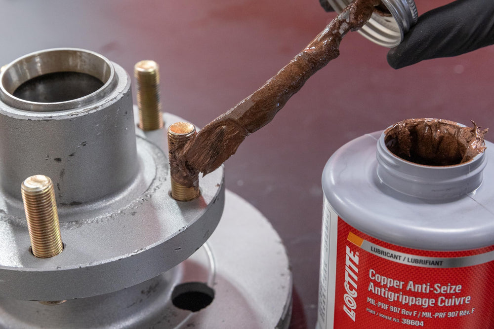 Loctite applied to spark plug threads for corrosion protection and conductivity