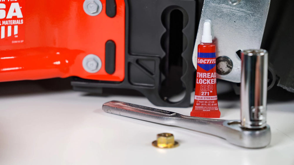 Loctite tube on a workshop bench showing professional repair use
