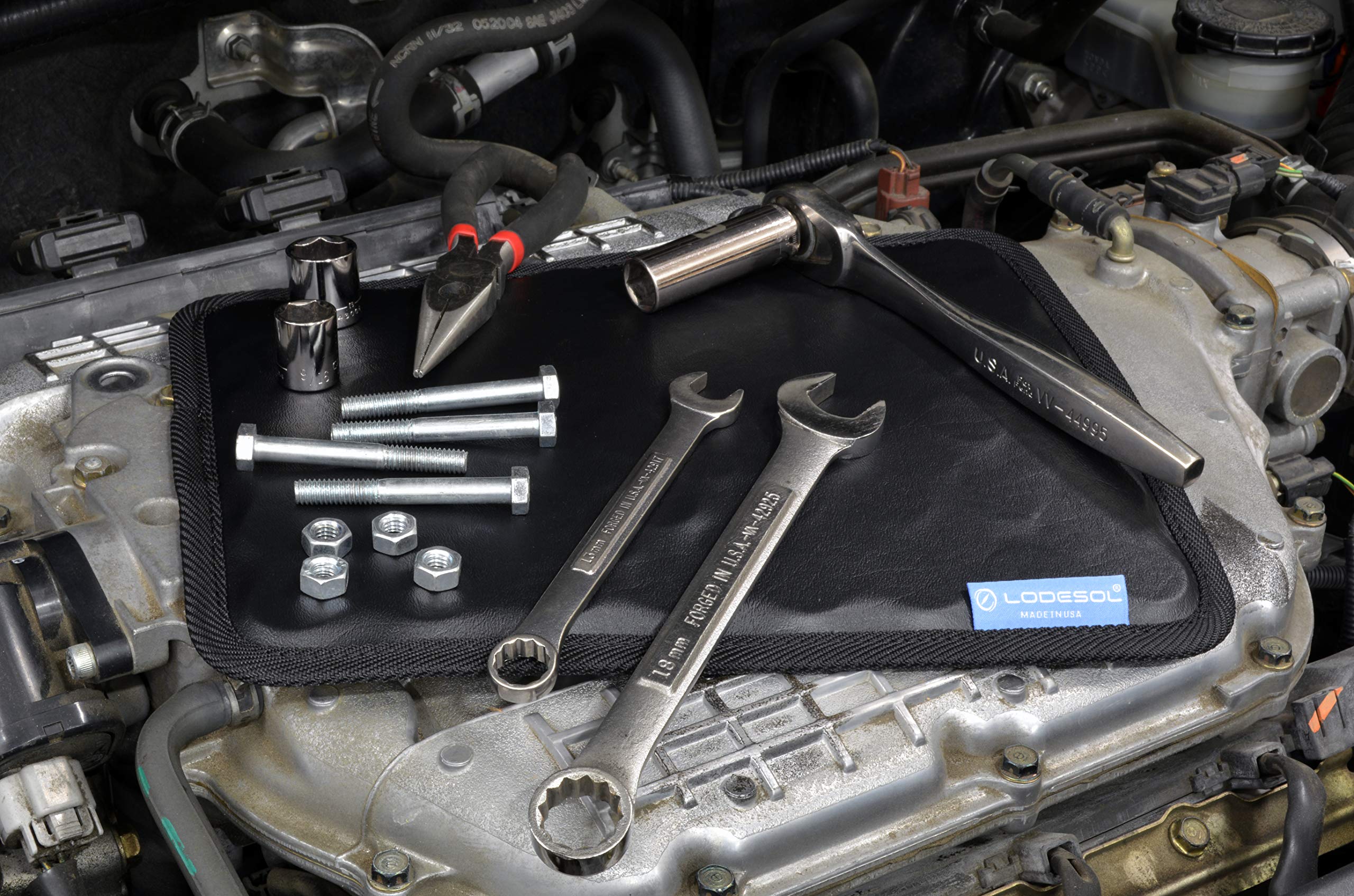 Lodesol magnetic surface holding sockets and wrenches securely in place