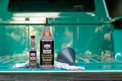 Pouring LUCAS OIL stabilizer into an engine oil fill, aiding lubrication
