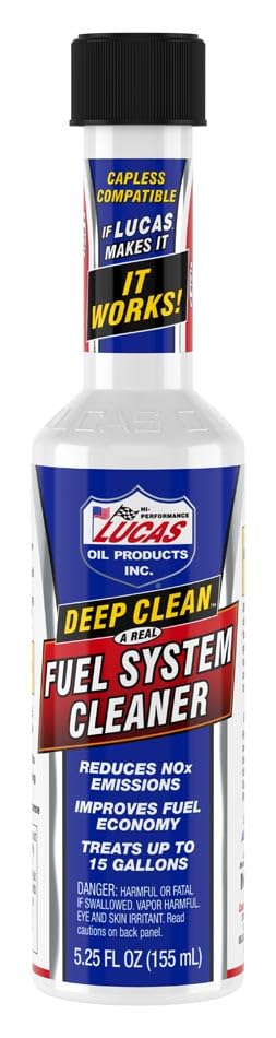 Lucas Oil renewal kit staged in a garage by a vehicle to show easy at-home performance maintenance