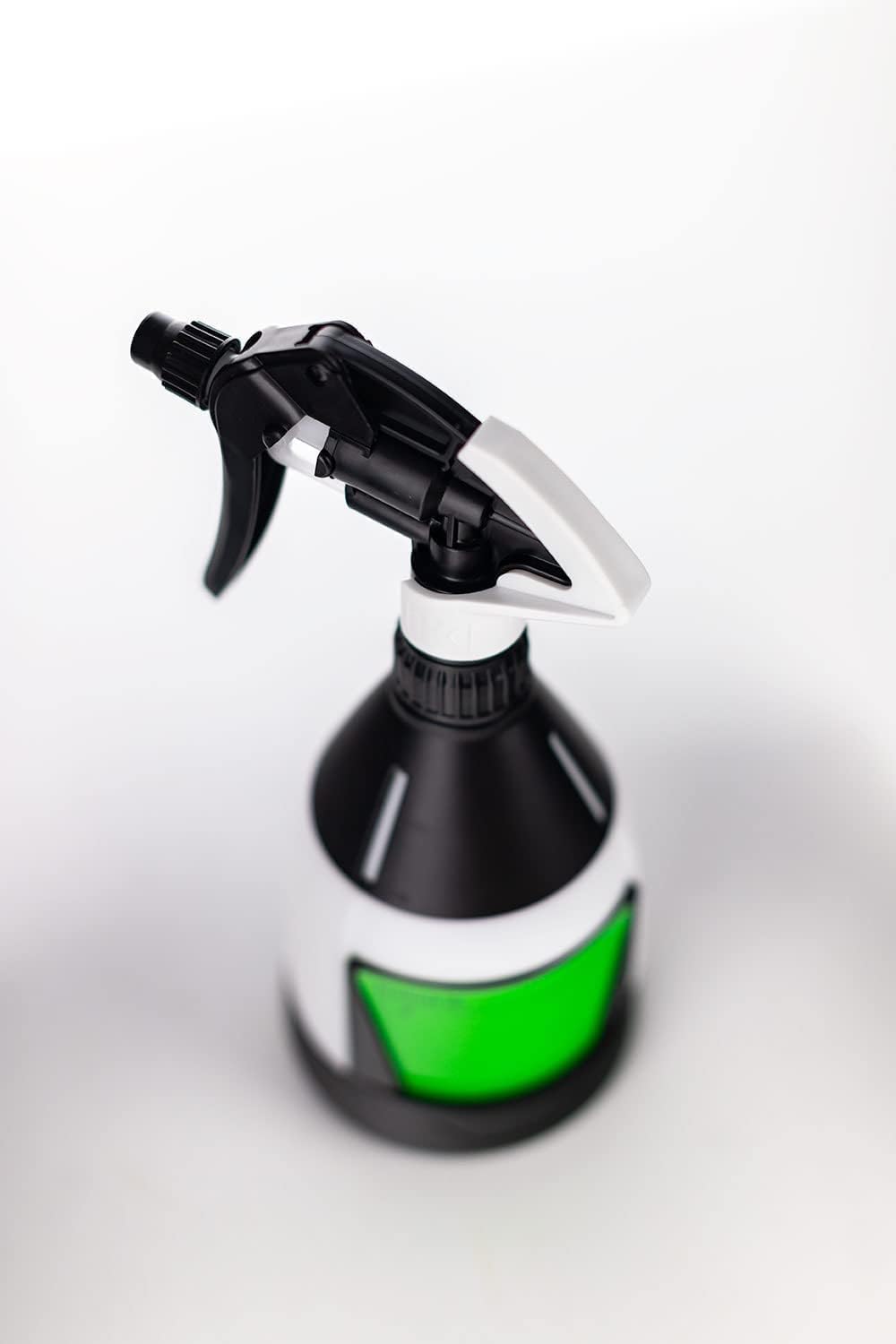 Lumintrail sprayer spraying upside down onto car trim to reach tight areas effectively