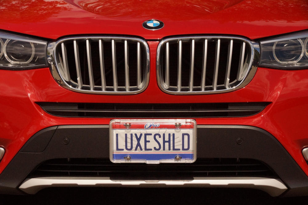 Luxe Shield in hand showing scale and easy-install benefit