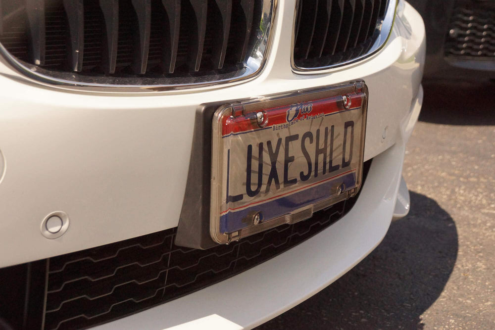 Luxe Shield lifestyle driveway shot conveying polished look and vehicle enhancement benefit