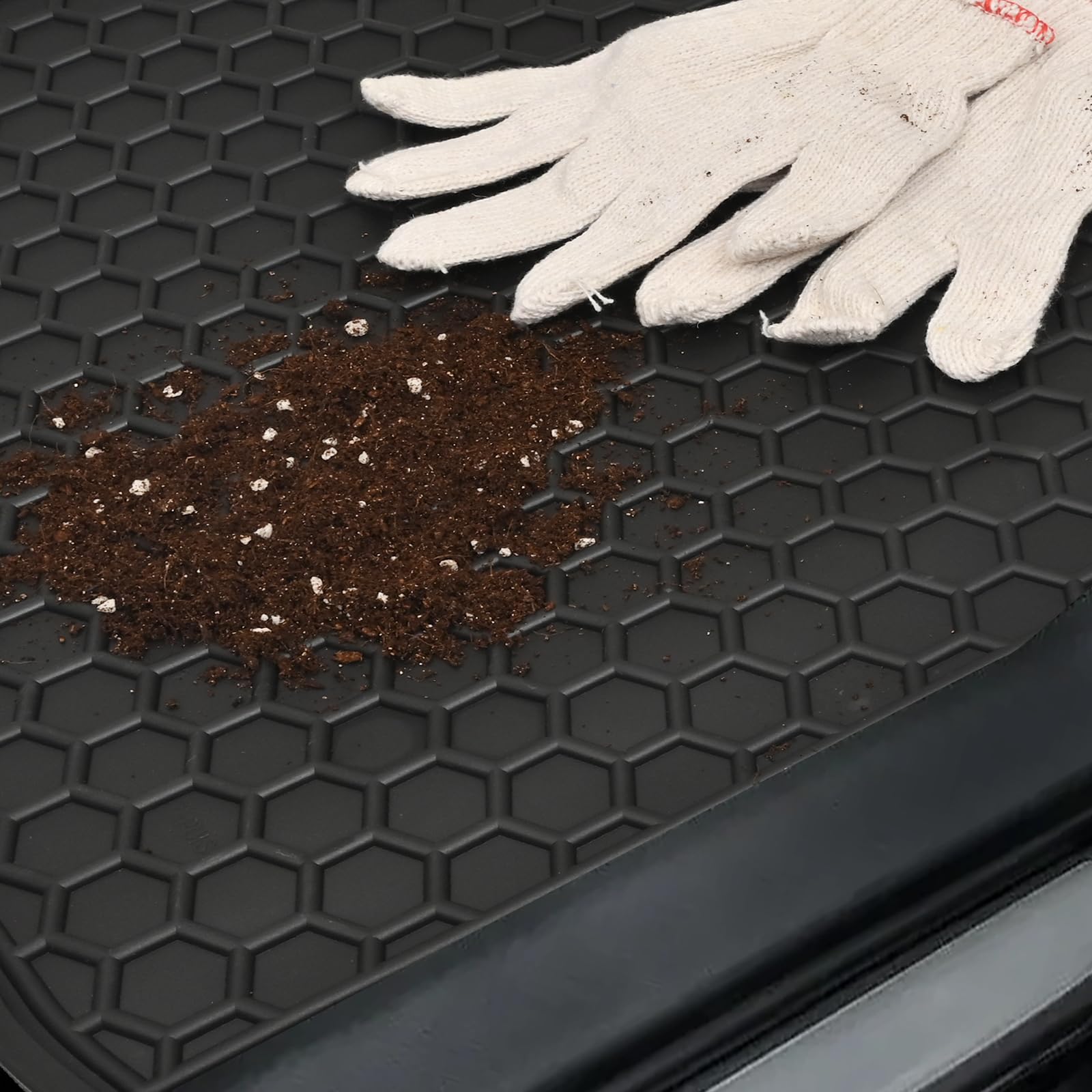 Lwope mat with water pooled to show waterproof containment benefit