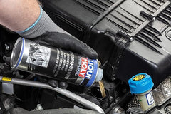 MAATSEN Liquii Moly pouring into engine oil filler for fast pre-oil-change cleaning