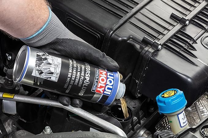 MAATSEN Liquii Moly Pro-Line pouring into engine oil filler showing simple pre-oil-change cleaning