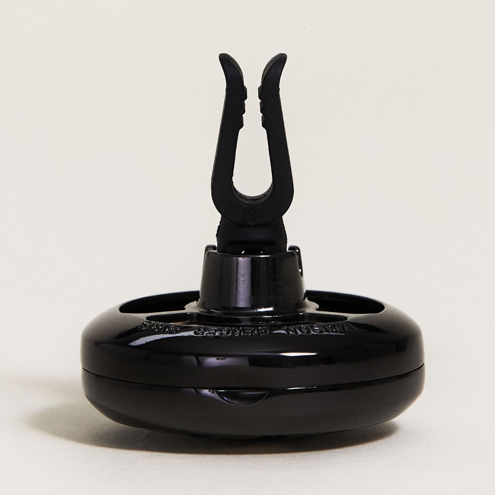 MAISON BERGER gun metal clipped on vent demonstrating secure, rattle-free grip