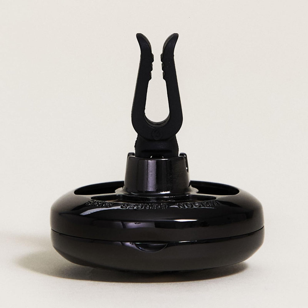 MAISON BERGER gun metal clipped on vent demonstrating secure, rattle-free grip
