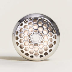 MAISON BERGER vent clip clipped to car vent demonstrating secure fit and silent diffusion