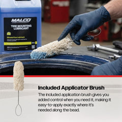 Malco lubricant being poured onto rim to reduce friction during mounting