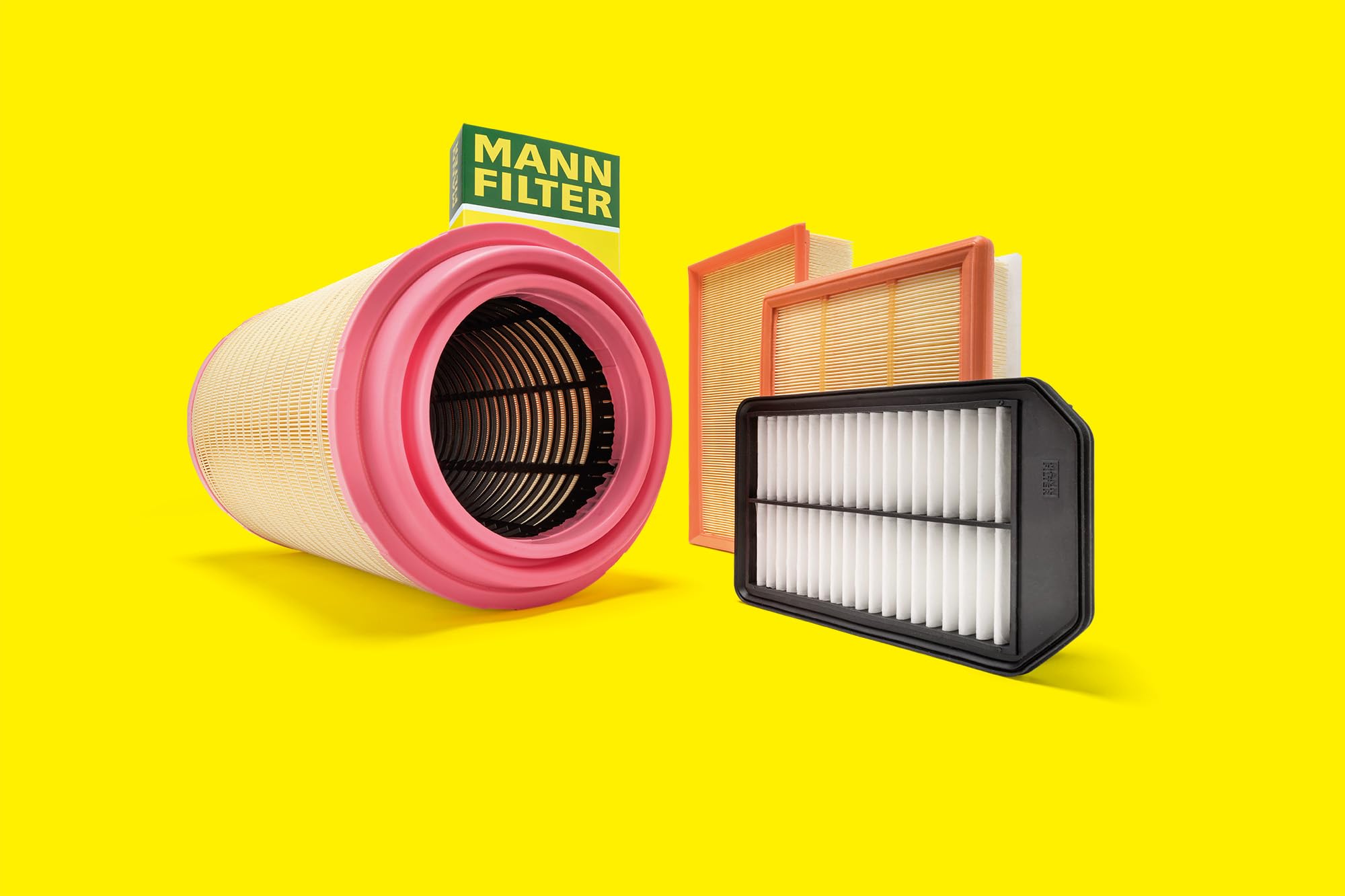 Mann Filter in a garage setting beside tools illustrating quick service and straightforward replacement
