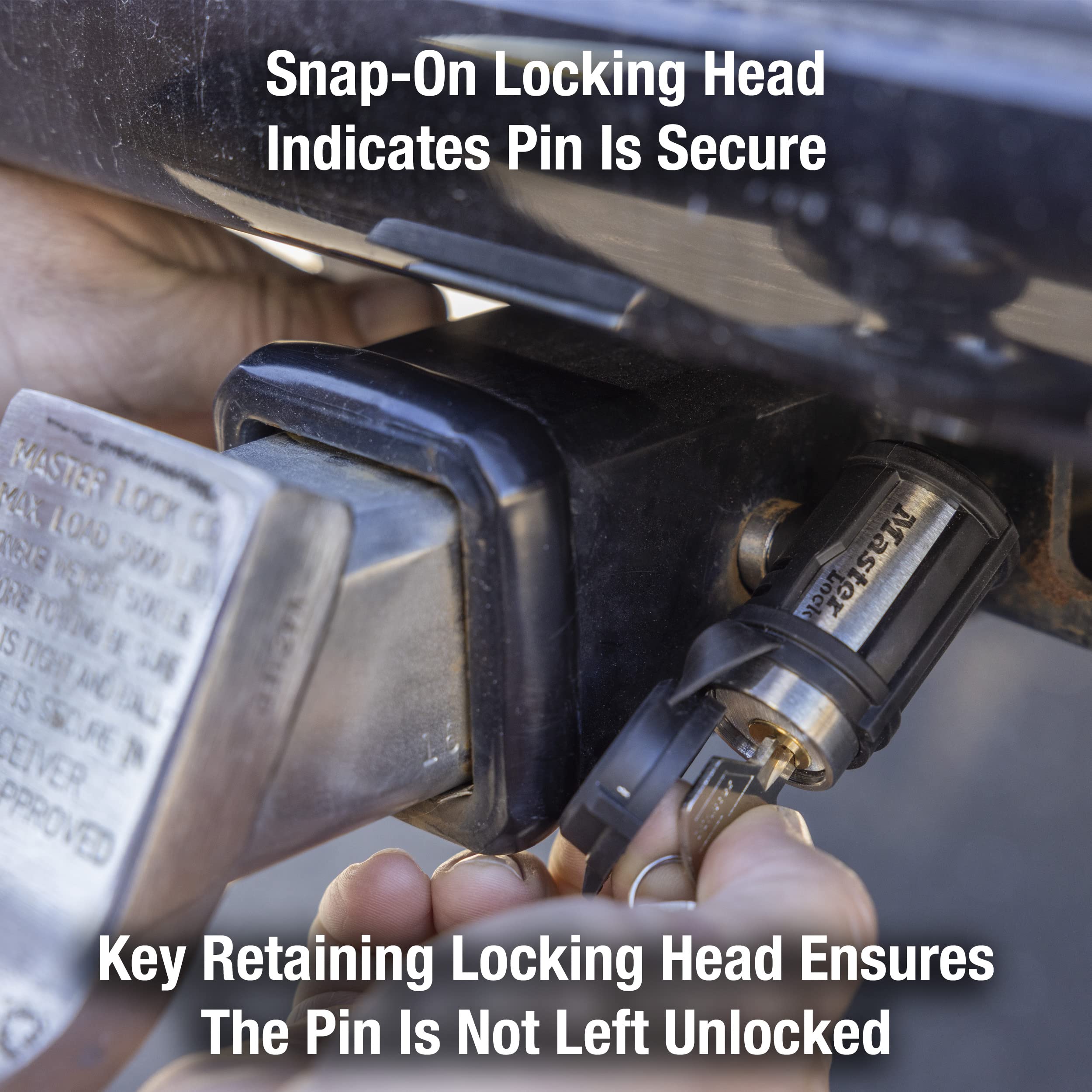 Master Lock receiver lock installed in trailer receiver demonstrating secure fit and quick quarter-turn lock