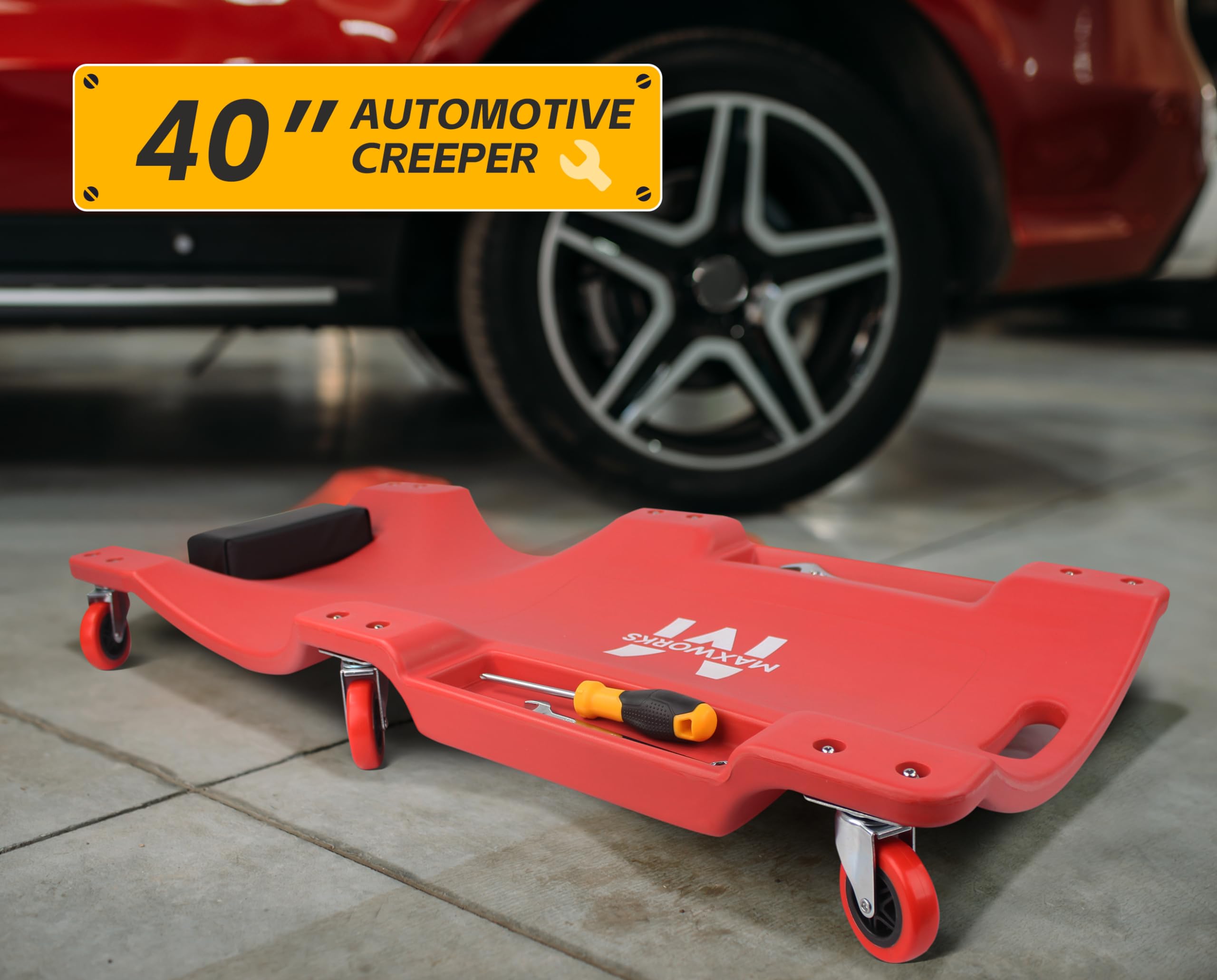 MaxWorks creeper next to car tire demonstrating 40-inch length scale and fit