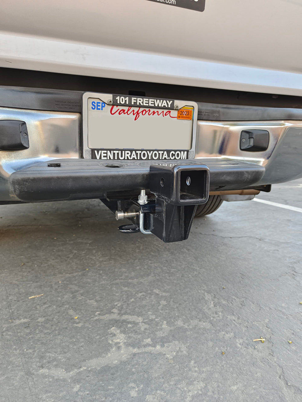 MAXXHAUL riser with included hitch pins showing secure installation benefit