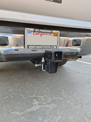MAXXHAUL riser with included hitch pins showing secure installation benefit