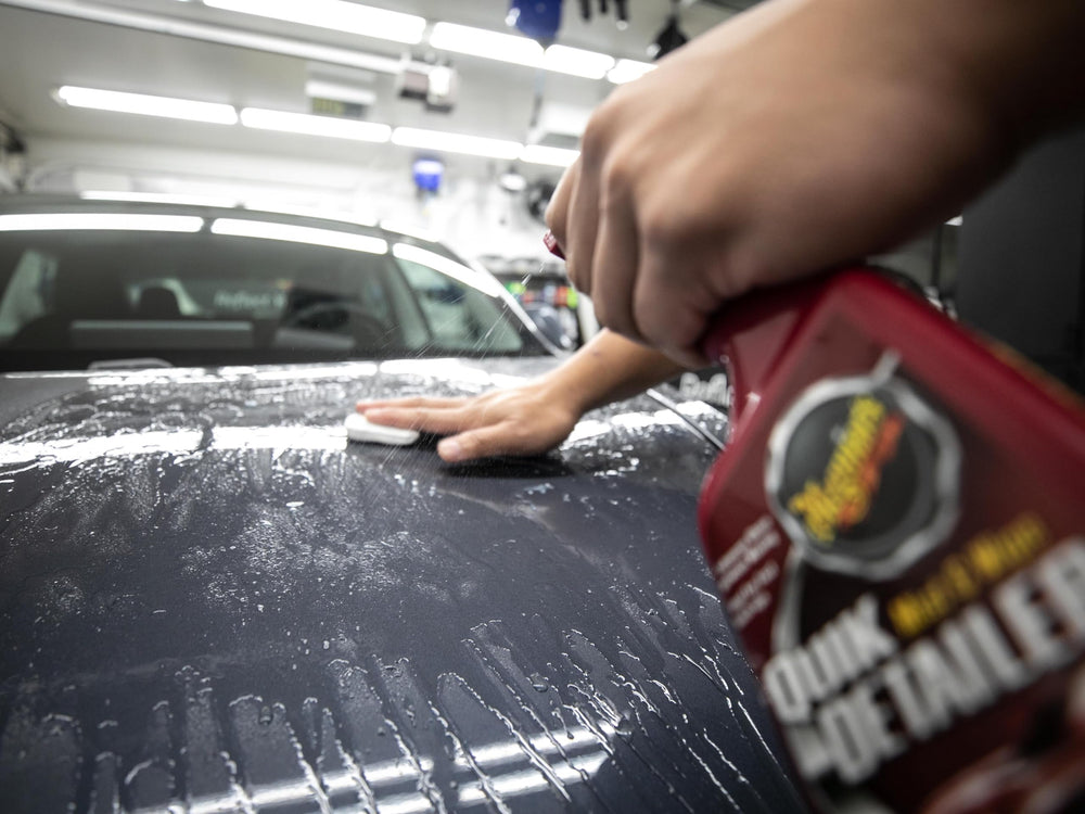 Clay removing paint overspray with Meguiar's showing contaminant lifting benefit