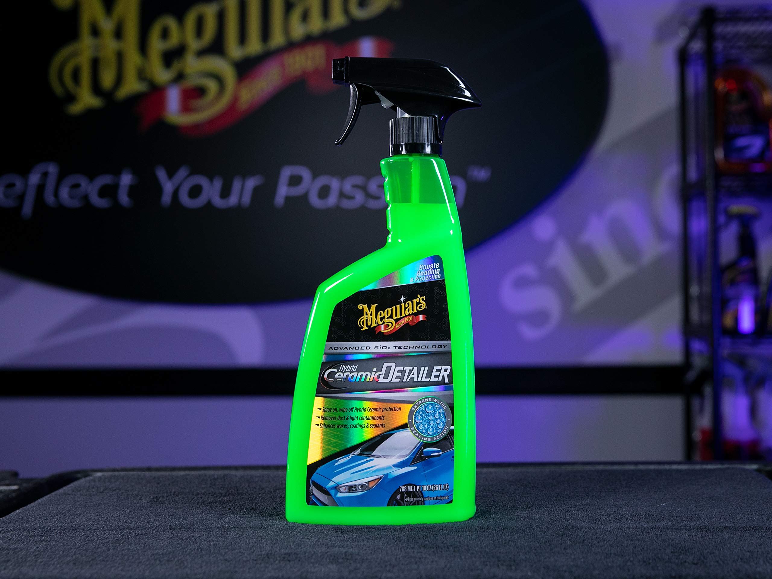 Meguiar's detailer being applied to a car panel showing maintenance benefit