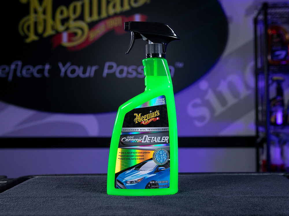 Meguiar's detailer being applied to a car panel showing maintenance benefit