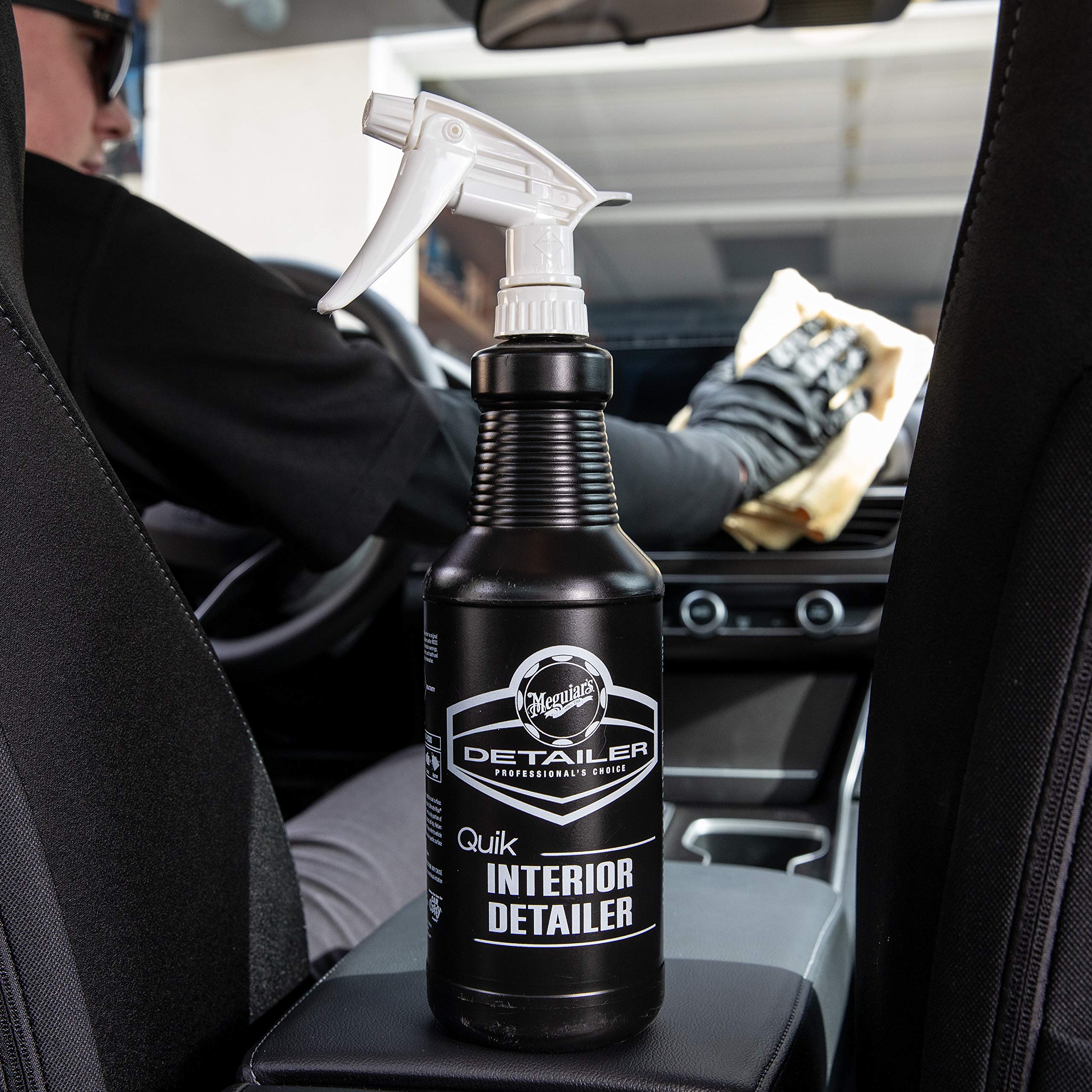 Meguiar's applying detailer to touchscreen showing safe cleaning benefit