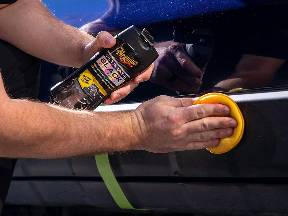 Meguiar's product used on parked car trim illustrating durable protection